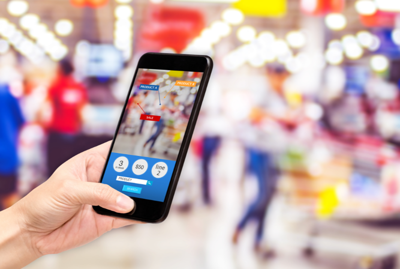 shopper using a mobile phone with augmented reality while shopping in a store